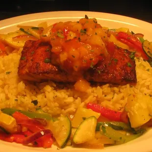 Wild Salmon with a Chipotle Butter and Mango Salsa over Rice Pilaf with fresh sauteed vegetables.  OMG GOOD