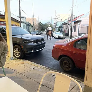 a woman sitting at a table outside