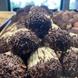 a variety of chocolate covered donuts