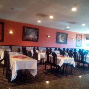 a restaurant with tables and chairs