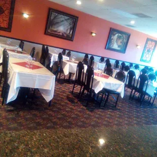 a restaurant with tables and chairs