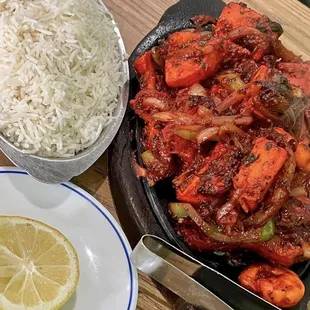 a bowl of rice and a plate of vegetables