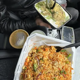 a tray of rice and vegetables