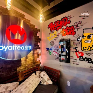 a coffee shop with graffiti on the wall