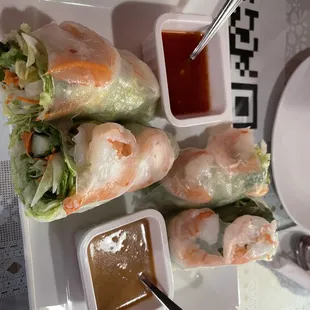 Shrimp spring rolls with their peanut butter sauce and sweet chili sauce.