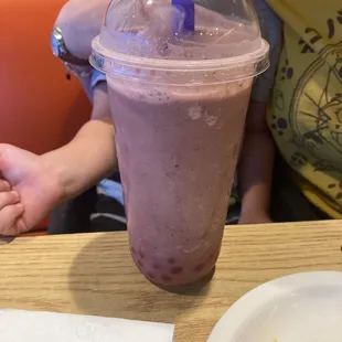 Blueberry pineapple smoothie with strawberry popping bobas