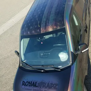 Royal Wrapz work van.  Wrapped in 3m psychedelic with printed carbon fiber hood and printed American flag on the roof.