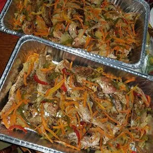 two pans of food on a table