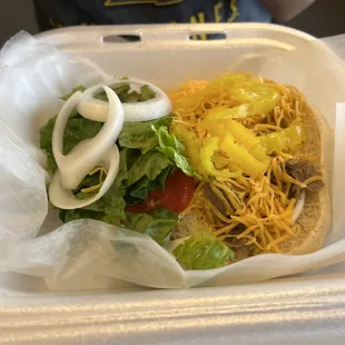 a taco in a styrofoam container