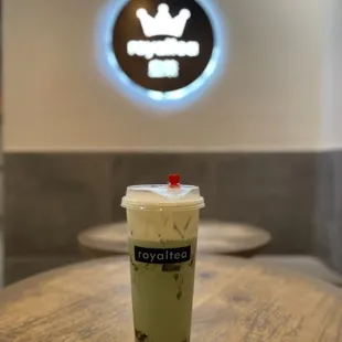 a cup of iced coffee on a table