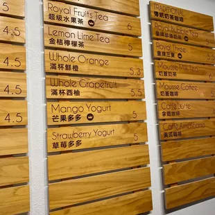 a number of wooden signs on a wall