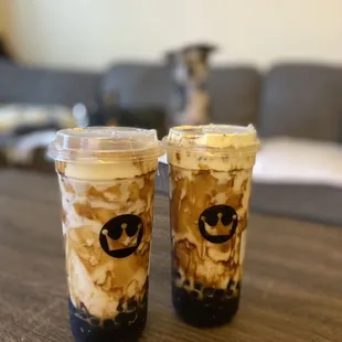 two cups of iced coffee on a table