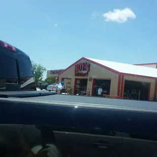 Look for the Mattress Firm sign.  Roy&apos;s is to the right of it.  Drive slowly or you will miss the entrance to the parking lot.