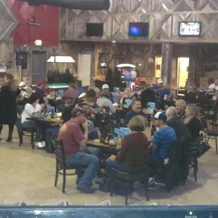 a large group of people sitting around a table
