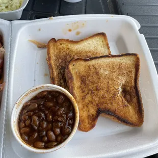 Sides: Baked beans and Texas toast.