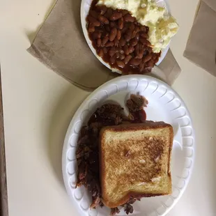 Brisket sandwich with potato salad and baked beans. YUM
