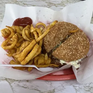 A BBQ Pork Sandwich, with coleslaw and curly fries.