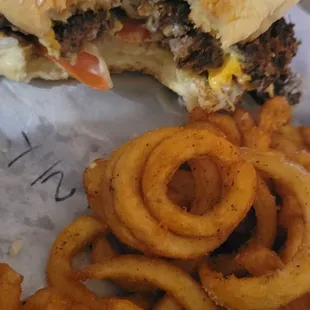 a hamburger and onion rings