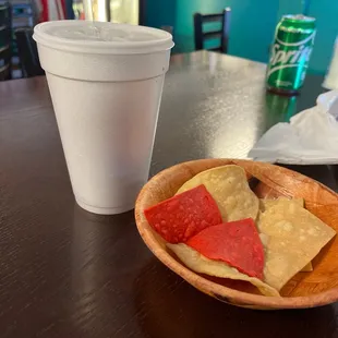 a plate of chips and a drink