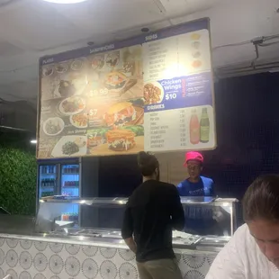 two people at a restaurant counter