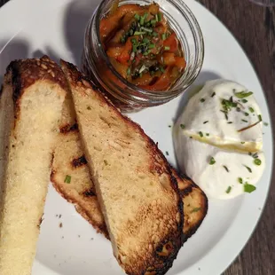 Burrata and fried peppers with house made sesame bread.