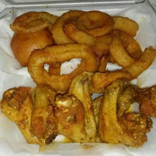 Garlic Parmesean wings with onion rings and a roll