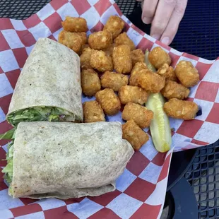 Moms Southwest Chicken Wrap and tater tots. My moms food was da bomb dot com.