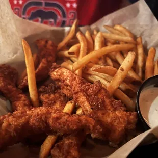 a basket of fried chicken and french fries
