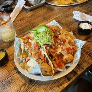 Oh my the nachos and I added shrimp this is a two person nacho.