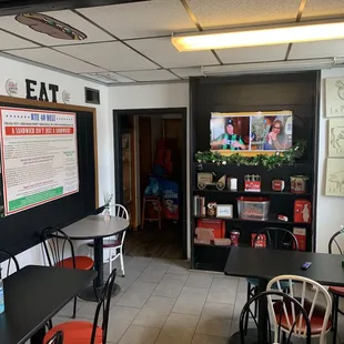 a restaurant with tables and chairs
