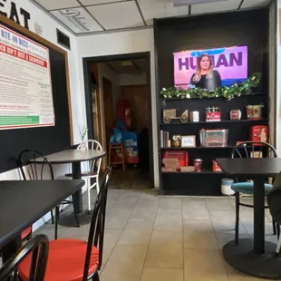 a man sitting at a table in a restaurant
