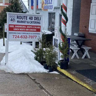 a sign in front of a business