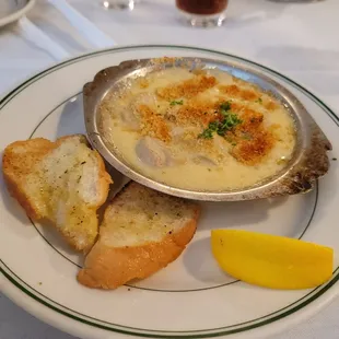 a clamber and bread on a plate