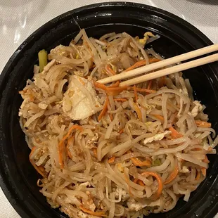 a bowl of rice with chopsticks