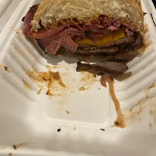 My husband's tri tip sandwich with pastrami, bacon, cheddar and grilled onions. Mouth watering