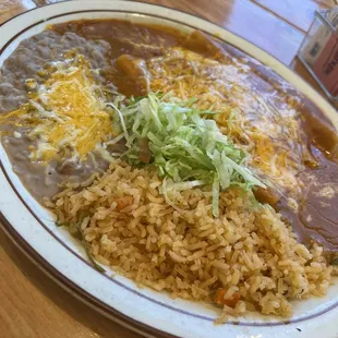 Enchilada, rice and beans plate