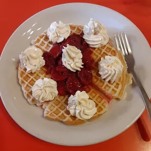 Waffle with strawberries and whipped cream