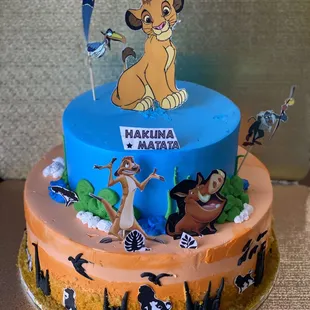 Two tier lion king theme cake! (cake toppers may very, there were brought in by customer!)