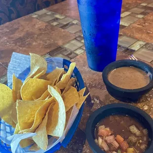Warm chips, fresh chunky medium salsa and yummy bean dip.