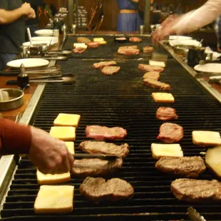 Texas toast and steaks on the grill.