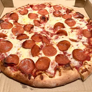 Pizza with Cheese + 1 Topping (Pepperoni). Medium (ten slices). House made sauce &amp; dough. Thick, stringy mozzarella cheese.