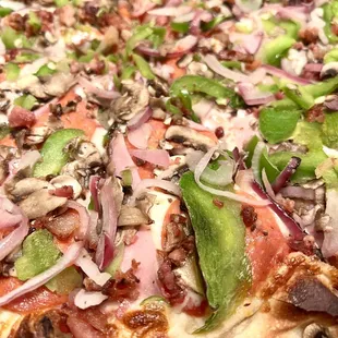 Rubino's Special Pizza. Medium (10 slices). Vegetables are thinly sliced as to not overpower the mozzarella cheese which is the best part!