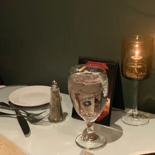 a glass of water and a candle