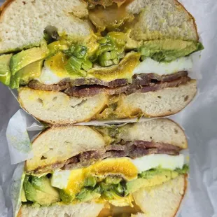 Egg, avocado and bacon bagel sandwich