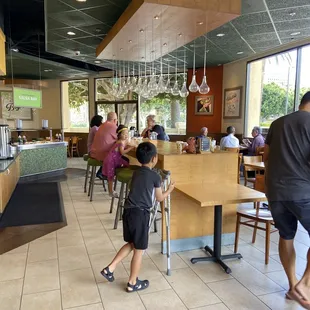 a man and a child in a restaurant