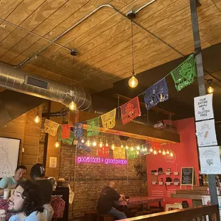 people sitting at tables in a restaurant