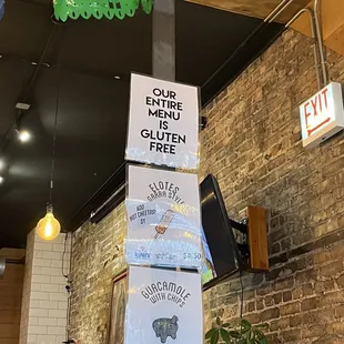 a sign on a pole in a restaurant