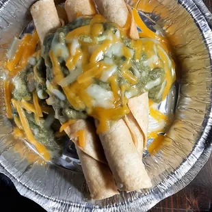 3 taquitos with guacamole