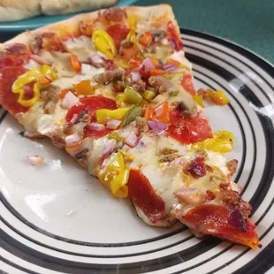 a slice of pizza on a plate
