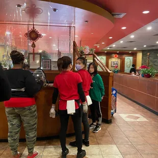 people standing in line at the counter